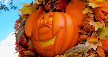 orange jack o lantern on brown wooden table