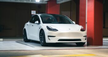 a white car parked in a parking garage