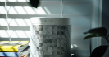 gray and black speaker on white table