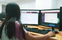 woman using desktop computer