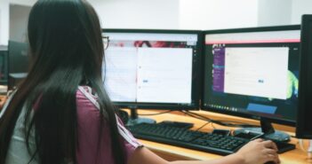 woman using desktop computer