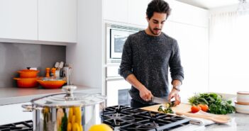 man cutting vegetables