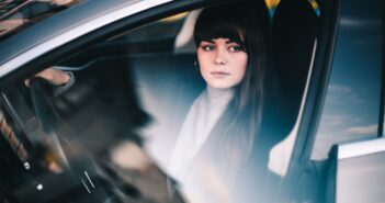 woman sitting inside vehicle