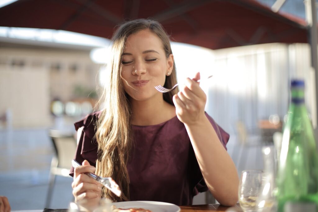 Woman in Purple Eating