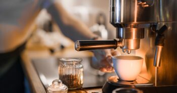 a coffee maker is making a cup of coffee