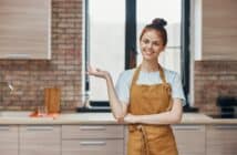 cheerful woman kitchen apartment kitchen utensils interior household concept