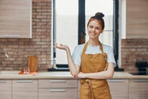 cheerful woman kitchen apartment kitchen utensils interior household concept