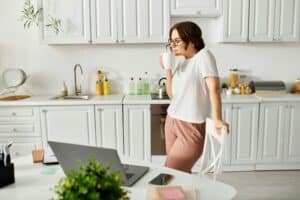 Harmonious Fusion: Woman, Kitchen, Laptop