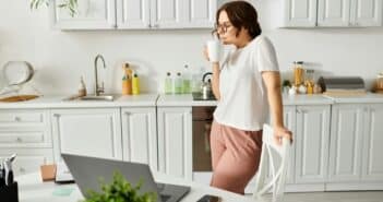 Harmonious Fusion: Woman, Kitchen, Laptop