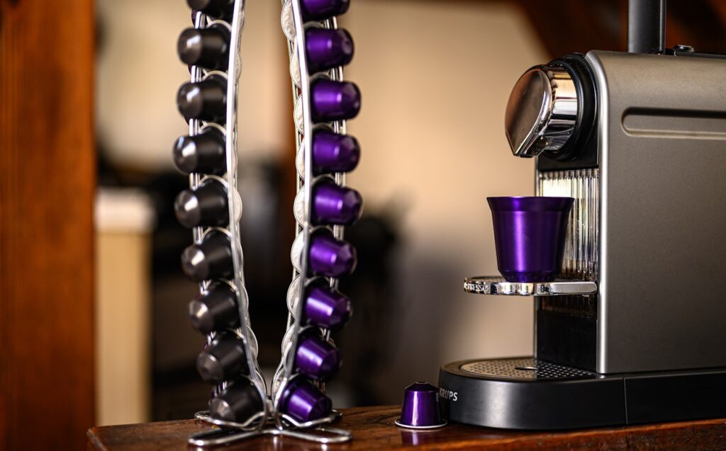 purple and silver trophy on brown wooden table