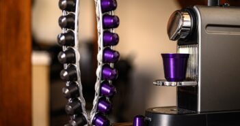 purple and silver trophy on brown wooden table