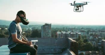 Man with drone flying at the city