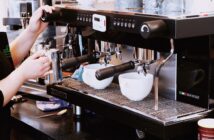 person holding black espresso maker