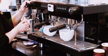 person holding black espresso maker