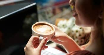 Woman Drinking Coffee in Coffeeshop