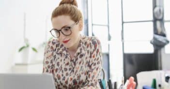 Woman in office using computer