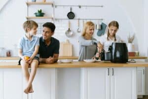 Happy family cooking morning breakfast by Air Fryer in kitchen at home.