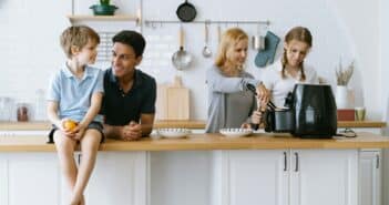 Happy family cooking morning breakfast by Air Fryer in kitchen at home.