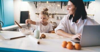 Mother and daughter cooking in kitchen