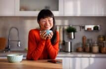 Woman drinking morning coffee in the kitchen