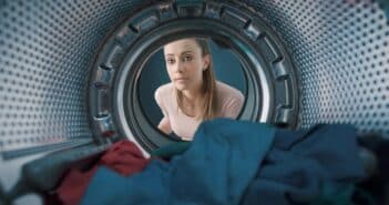 Woman loading the washing machine