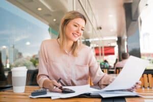 Young businesswoman working at coffee shop.