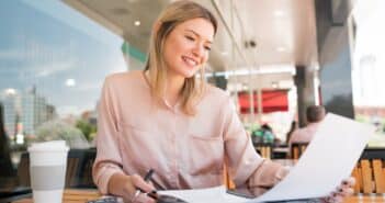 Young businesswoman working at coffee shop.